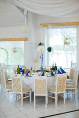 stylish luxury decorated table for guests for a wedding in the r