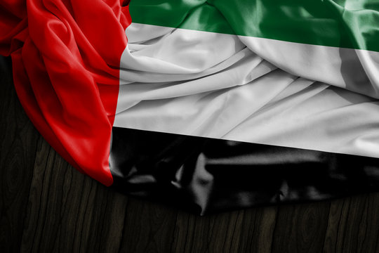 UAE flag on wooden table