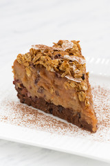 piece of apple and caramel cake on plate, vertical