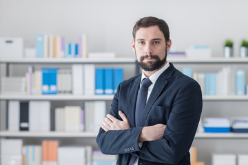 Confident businessman in his office