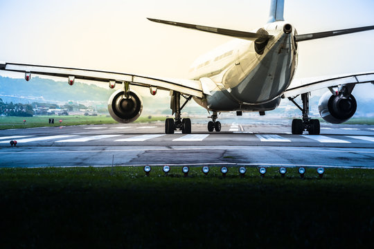 Ready For Take Off / Airplane Goes To The Position For Takeoff At An Airport Runway At Mysteriously Retro Twilight (copy Space)