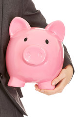 Young business woman holding piggybank