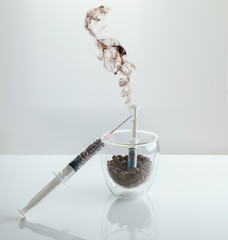 Coffee intravenous drug. Coffee Beans in plastic syringe.