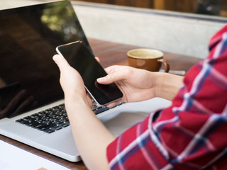 Man working on a wooden desk in a morning
