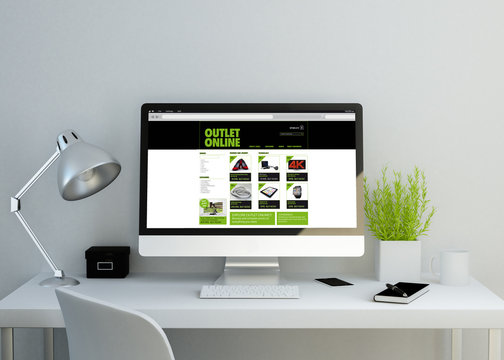 modern clean workspace with online shop website on screen