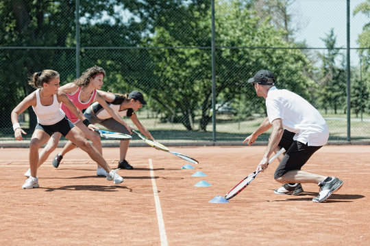 Touching markers, cardio tennis fitness class