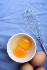 Eggs in a bowl with whisk