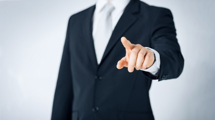 close up of man pointing finger to something