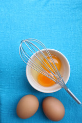 Eggs in a bowl with whisk