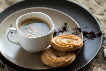cup of hot espresso coffee, and cookie