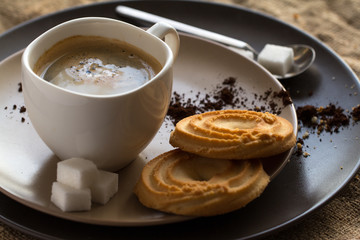 cup of hot espresso coffee, and cookie