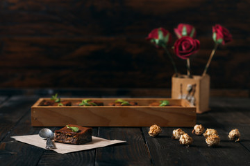 Chocolate  brownie on the dark vintage table. 