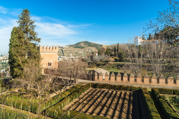 Fototapeta na wymiar View of the fortress wall, Generalife and Albaicín from the Alhambra. Granada. Spain