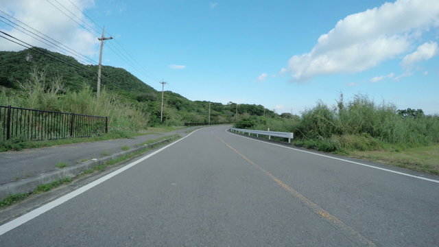 Blue sky drive through the beautiful nature in ishigakijima, Okinawa.