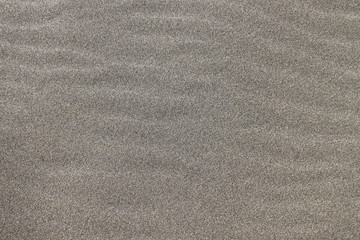 Fototapeta na wymiar Sable noir sur la plage à La Réunion