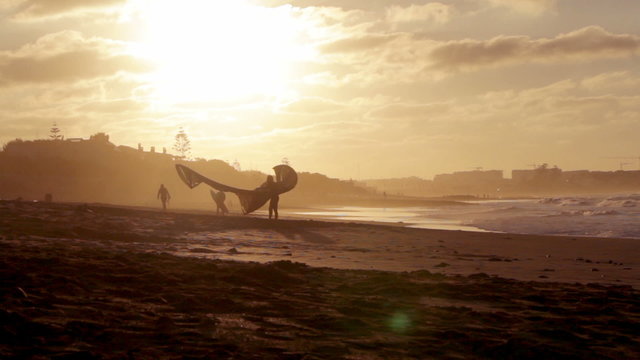 Kyte surfer Sunset Atlantic Ocean view at Dar Bouazza beach, Casablanca. Morocco..