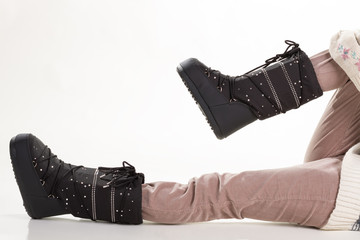 Warm ski boots and clothes.