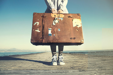 young woman ready to travel with her suitcase - obrazy, fototapety, plakaty