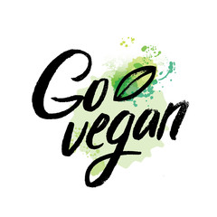 Naklejka premium Words GO VEGAN in simple and cute frame with green branches and leaves. Vectorized watercolor drawing.