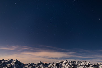 The starry sky above the Alps in winter, Orion Constellation