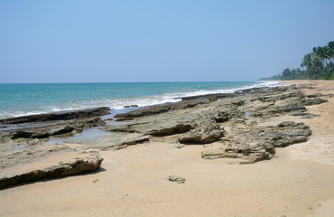 Fototapeta na wymiar Stones on the idyllic beach in Sri Lanka.