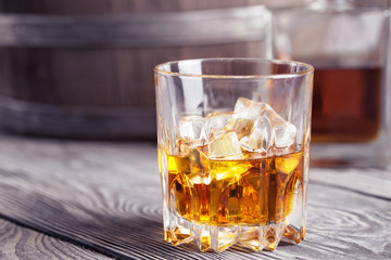 Bright faceted glass of whiskey