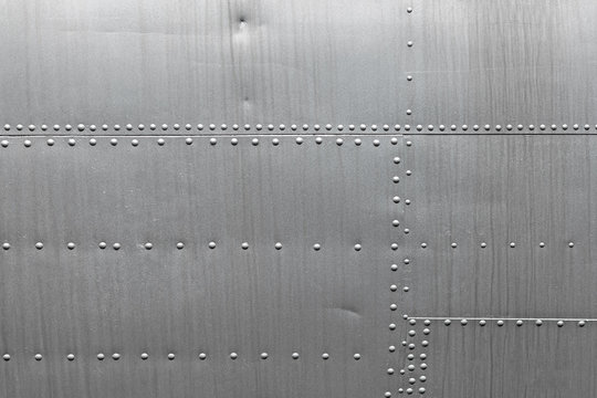 Abstract metallic background. Silver metal texture with rivets. Stock Photo  | Adobe Stock