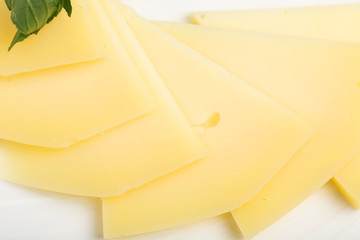 Closeup of sliced gouda cheese.