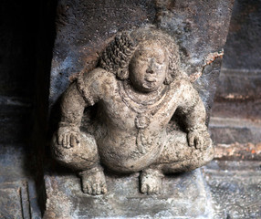 Fototapeta na wymiar Stone figure of Bharvahaka Yaksha in Ajanta caves, India