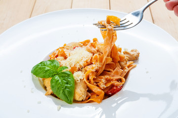 Eating traditional italian pasta  with fork