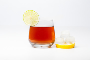 Ice tea with ice lemon and lime