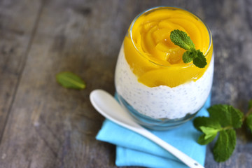 Chia pudding with oat and peach slices.