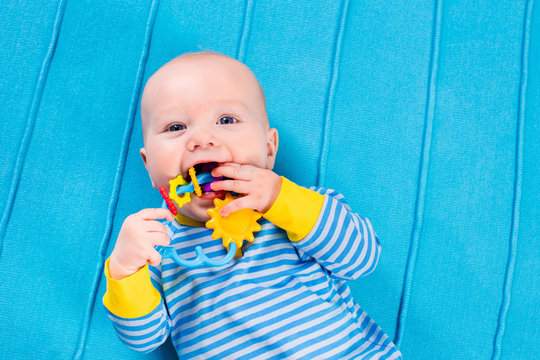 Baby Boy On Blue Knitted Blanket