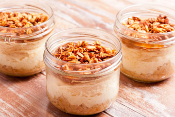 dessert with cream, granola and jam, closeup, horizontal