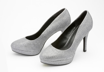 Silver high heeled party shoes.