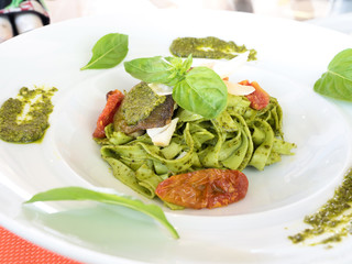 special recipe, rainbow trout and cheese on green pasta
