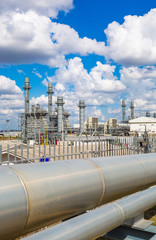 Steam turbine power plant with cloudy sky