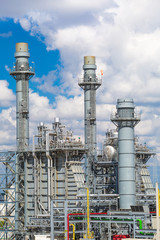 Steam turbine power plant with cloudy sky