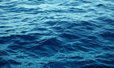 Fotobehang Oceaan golf Blue sea with waves close up