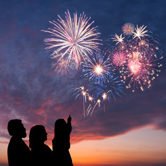 Happy family and holiday fireworks