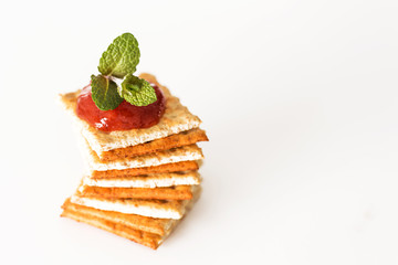 Pile of crackers with ketchup on top