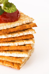 Pile of crackers with ketchup on top