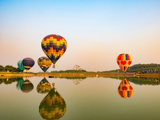 Fototapeta premium balloons in the start of journey trip on sunset sky