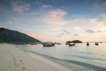 Long tail boats with sunrise sky in Koh Lipe Island