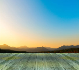 sunset background with empty plank under for put your products.
