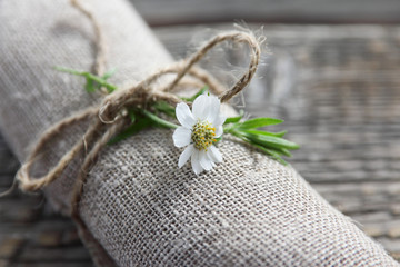 napkin with flower on a wooden background