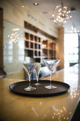 Martini glasses on tray in restaurant