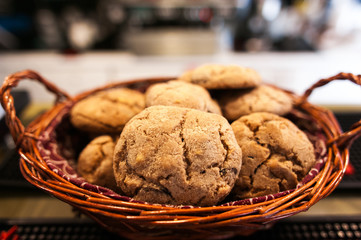 Chocolate cookies on white linen napkin on wooden table. Chocola