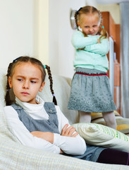 Portrait of two miserable girls having conflict