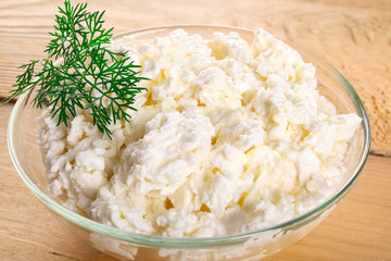Cottage cheese with fresh herbs bowls wooden board